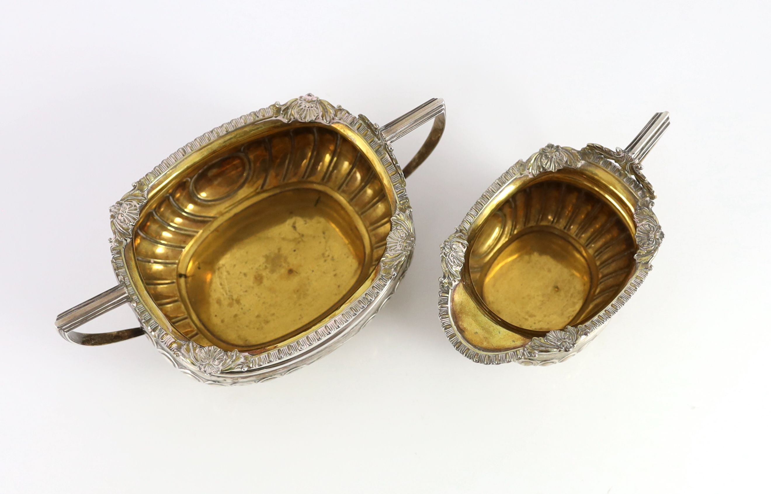 A George III Scottish silver demi-fluted three piece tea set by George Fenwick